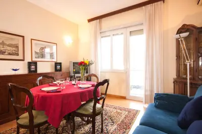 a dining room with a table with a red table cloth at Vatican Balcony in Rome