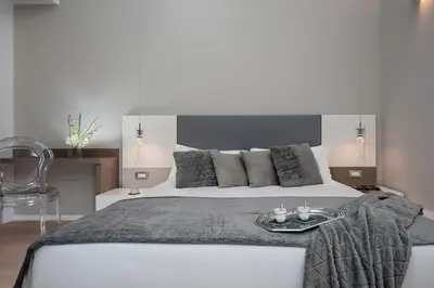 a bedroom with a large bed with a tray on it at Colosseum Corner in Rome