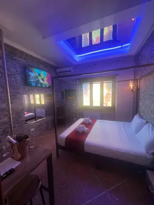 a bedroom with a large bed with a blue ceiling at Imperatore in Rome