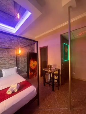 a bedroom with a bed and a table in a room at Imperatore in Rome