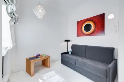 a living room with a couch and a table at Sora Luxury Inn in Rome