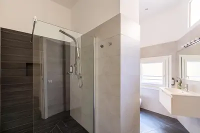 a bathroom with a shower and a sink at Residenza Ottaviano 105 by Hili in Rome