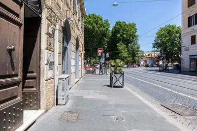 an empty street in a city with a building at Residenza Ottaviano 105 by Hili in Rome