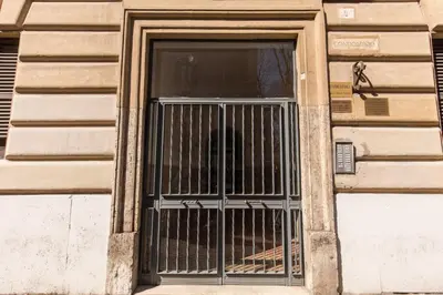 a door of a building with a dog in it at Loft in San Pietro in Rome