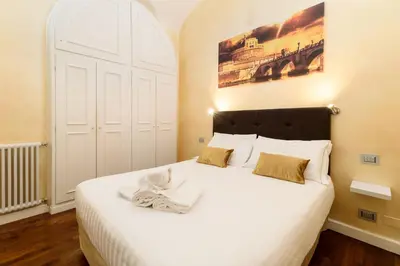 a black microwave oven with a key on it at Trinity Luxury Rooms in Rome