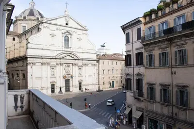 a view of a street in a city with buildings at Le Quattro Dame Luxury Suites in Rome