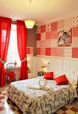 a room with a bed with a swan on it at I Love Piramide in Rome