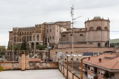 a large building in a city with buildings at Vatican Apartment in Rome