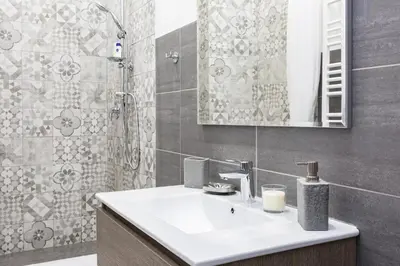 a bathroom with a sink and a mirror at G-House Pettinari in Rome