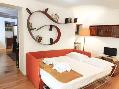 a bedroom with a bed with two towels on it at Navona Stay Apartment in Rome