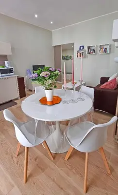 a white table and chairs in a living room at L'Esquilina Holiday House 2 in Rome