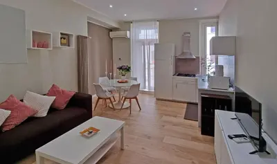 a living room with a couch and a table at L'Esquilina Holiday House 2 in Rome