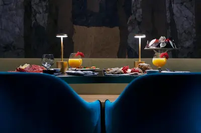 a table with food and glasses of orange juice at Hotel 87 eighty-seven - Maison d'Art Collection in Rome