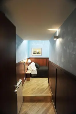 a view of a room with a bed and a hallway at Residenza Matteucci in Rome