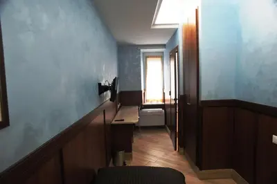 a hallway with a bathroom with a window and a toilet at Residenza Matteucci in Rome