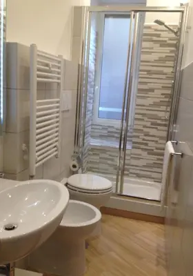 a bathroom with a toilet and a sink and a shower at Residenza Matteucci in Rome