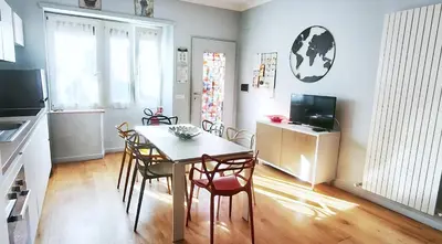 a kitchen and dining room with a table and chairs at Casa Santarelli in Rome