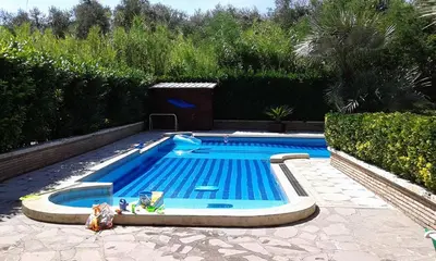 a small swimming pool in a yard with at Casa Santarelli in Rome