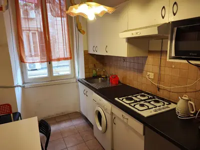a small kitchen with a stove and a sink at Turati House in Rome