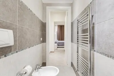 a bathroom with a sink and a mirror at Vaticano 38 Suites in Rome