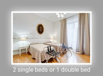 a bedroom with two single beds or double bed at Eluta Holiday Home in Rome
