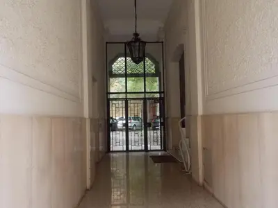 an empty hallway with a door and a window at Holiday House Roma Vaticano in Rome