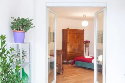 a mirror in a room with a bedroom at Boutique Domus in Rome