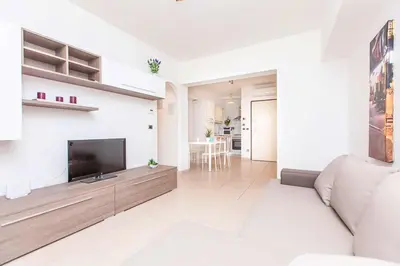 a living room with a large flat screen tv at Boutique Domus in Rome