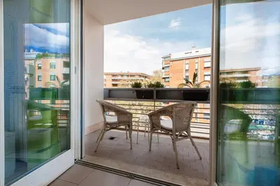 a balcony with a table and chairs on a balcony at Boutique Domus in Rome