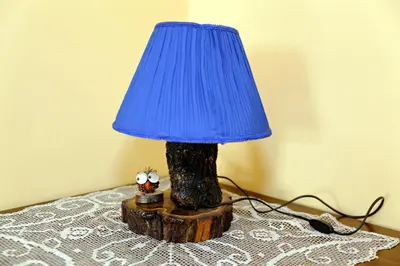 a blue lamp sitting on top of a tree stump at Casa Vacanza Da Andrea in Rome