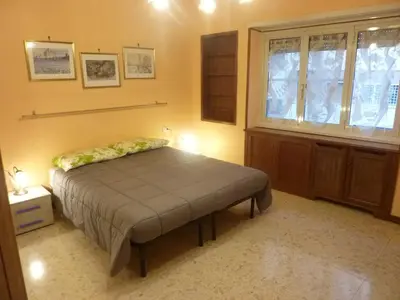a bedroom with a bed and a window at Casa Vacanza Da Andrea in Rome