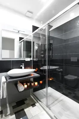 a bathroom with a sink and a glass shower at Homs Sweet Home in Rome