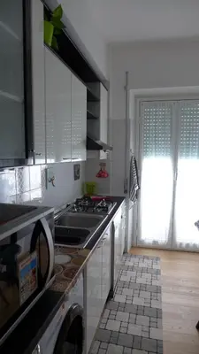 a kitchen with a sink and a stove top oven at Your Home at Rome in Rome