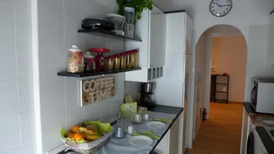 a kitchen with a counter with a bowl of fruit on it at Your Home at Rome in Rome