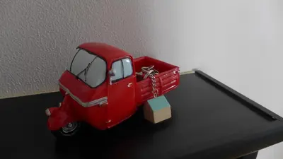 a red truck is sitting on top of a table at Your Home at Rome in Rome