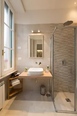 a bathroom with a sink and a shower at Vaticanspace Rooms in Rome