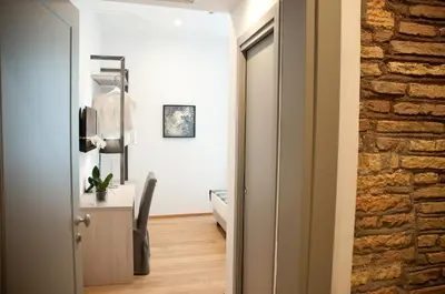 a door leading into a room with a bedroom at Giuturna Boutique Hotel in Rome
