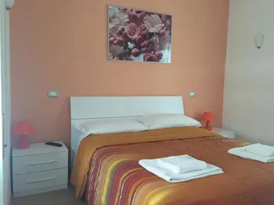 a bedroom with a bed with two towels on it at B&B SPQR in Rome