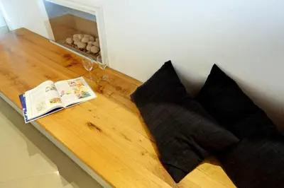 a table with two pillows and a book on it at Reginella in Rome