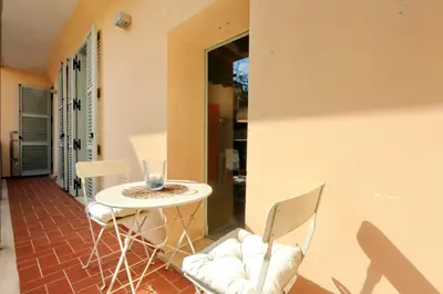 a small table and chairs on a patio at Reginella in Rome