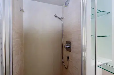 a shower in a bathroom with a glass door at Reginella in Rome