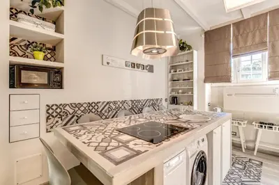 a kitchen with a island with a counter top at Vatican Sweet Home in Rome