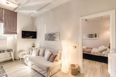a living room with a couch and a bed at Vatican Sweet Home in Rome
