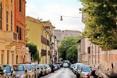 a city street with cars parked on the side of the road at Laterano 238 Apartment in Rome