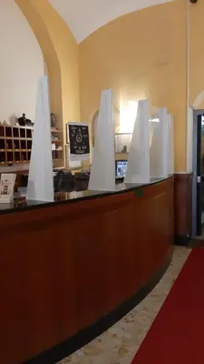 a counter with white objects on top of it at Hotel Altavilla 9 in Rome
