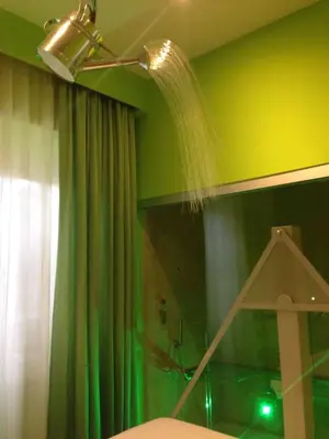 a hairdryer is being used on a green wall at iRooms Central Station in Rome