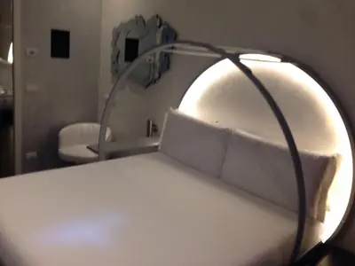 a hospital bed with a mirror in a room at iRooms Central Station in Rome