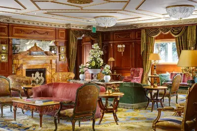 a living room filled with furniture and a fireplace at Parco dei Principi Grand Hotel & SPA in Rome