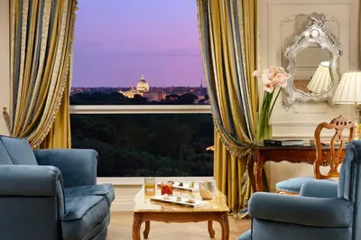 a living room with a view of the capitol building at Parco dei Principi Grand Hotel & SPA in Rome