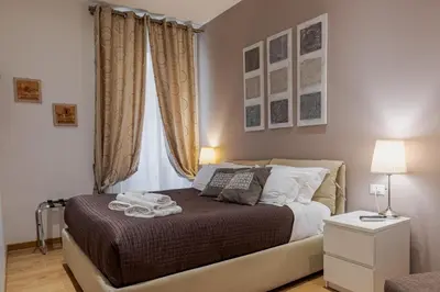 a bedroom with a bed and a window at Sweet Stay In Rome in Rome